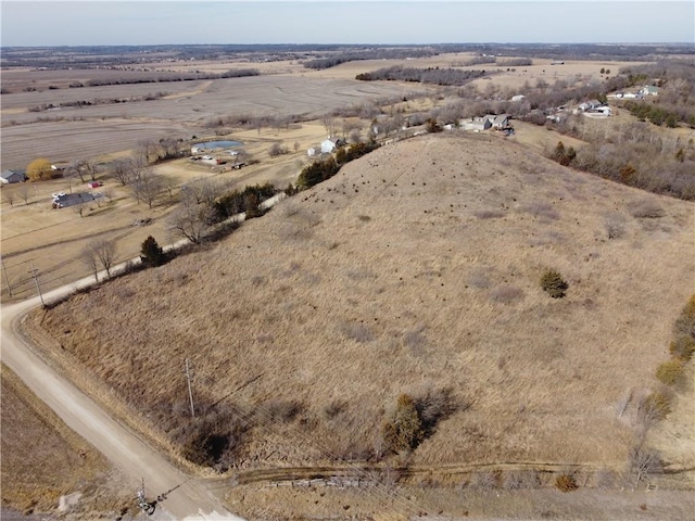 birds eye view of property featuring a rural view