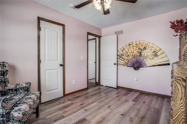 bedroom featuring ceiling fan and light wood-type flooring