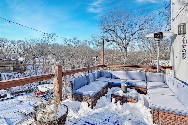 view of snow covered deck