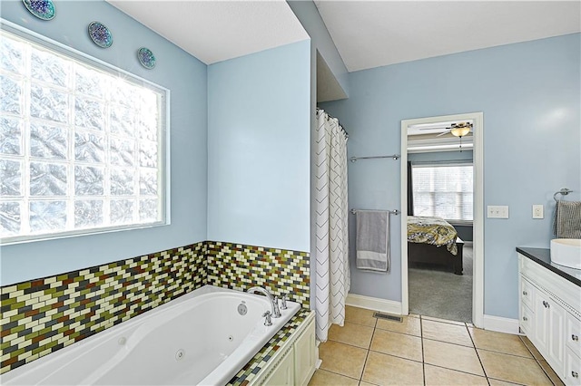 bathroom with vanity, tile patterned floors, and a bathing tub