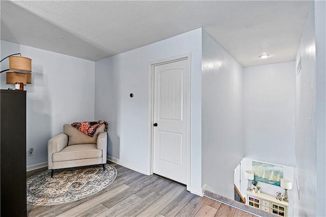 living area with light hardwood / wood-style flooring