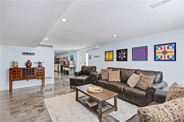 living room with a textured ceiling