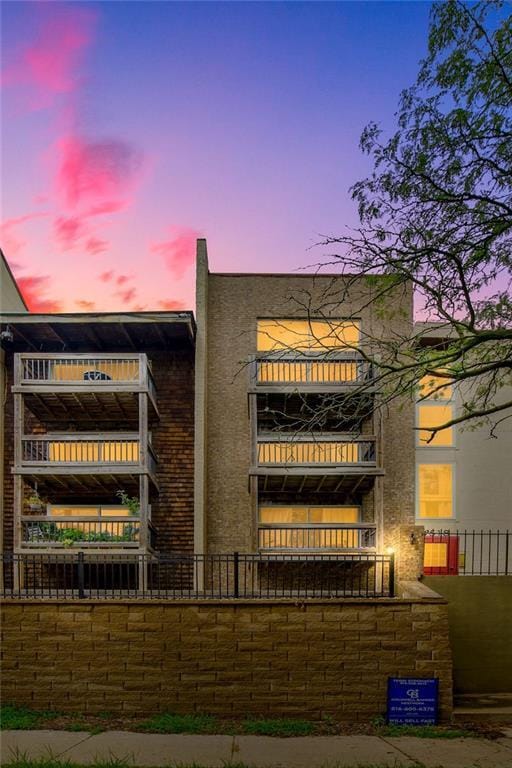 view of outdoor building at dusk