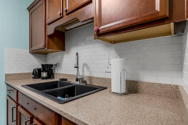 kitchen with sink and tasteful backsplash