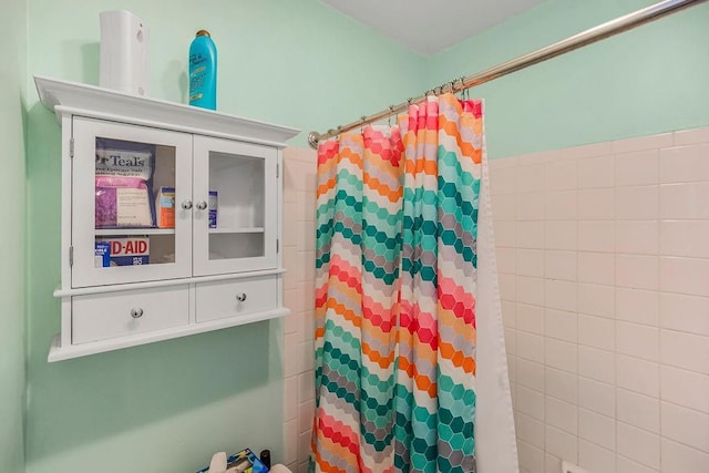 bathroom featuring walk in shower