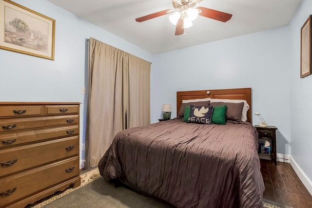 bedroom featuring ceiling fan and dark hardwood / wood-style flooring