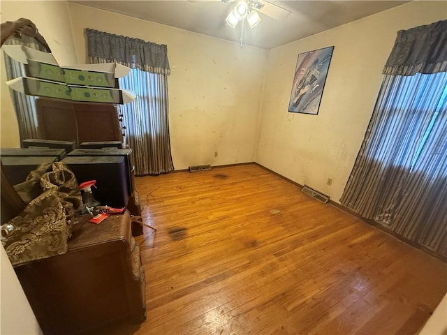 bedroom featuring hardwood / wood-style floors and ceiling fan