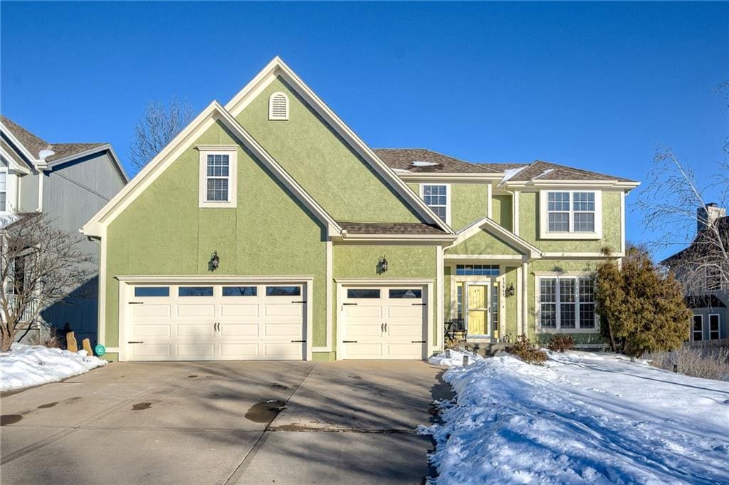 view of front of property with a garage