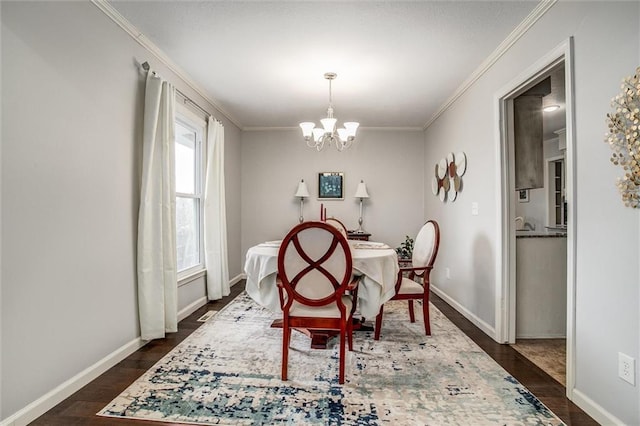 dining room featuring a chandelier, baseboards, dark wood-type flooring, and ornamental molding