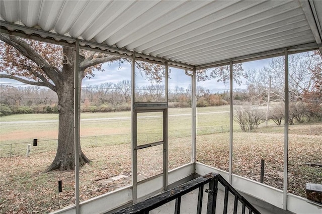 unfurnished sunroom with plenty of natural light