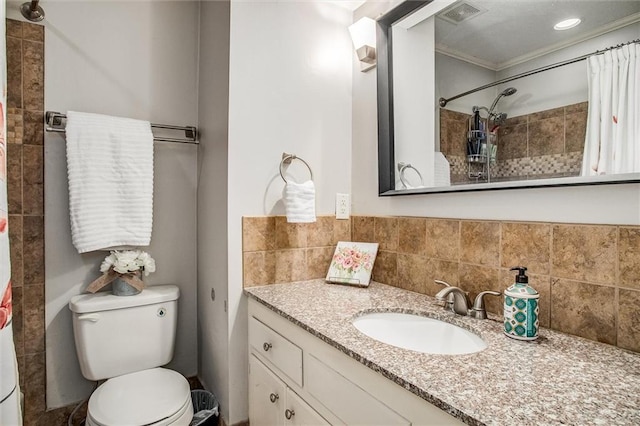 full bath featuring visible vents, toilet, ornamental molding, tiled shower, and vanity