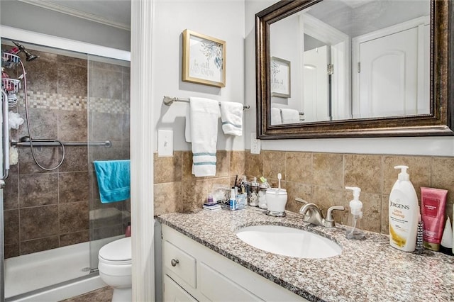 full bath featuring vanity, a stall shower, ornamental molding, tile walls, and toilet