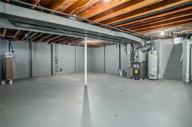 unfinished below grade area with stairs, gas water heater, and heating unit