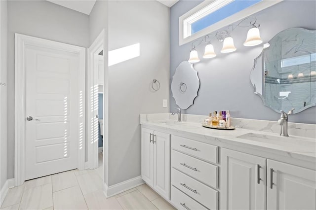 bathroom featuring tile patterned floors, walk in shower, and vanity