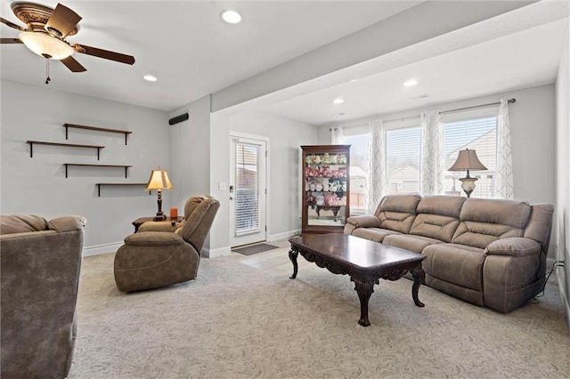 living room featuring ceiling fan and light carpet