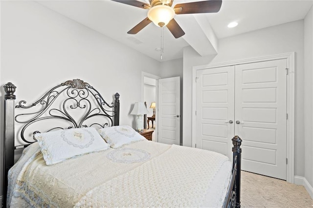 bedroom with ceiling fan and a closet