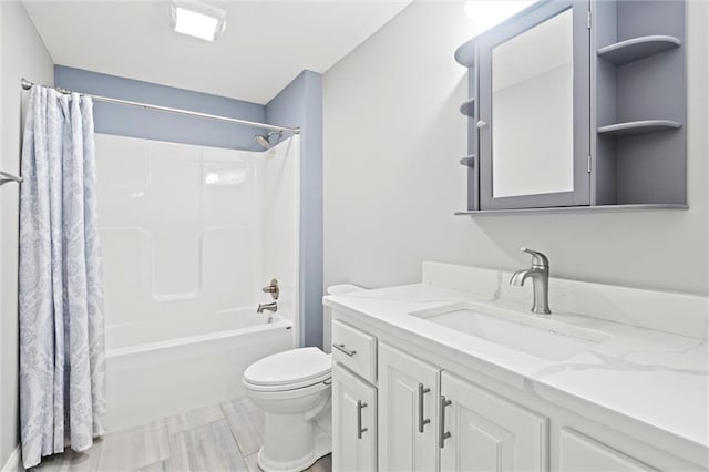 full bathroom featuring shower / bath combo with shower curtain, toilet, and vanity