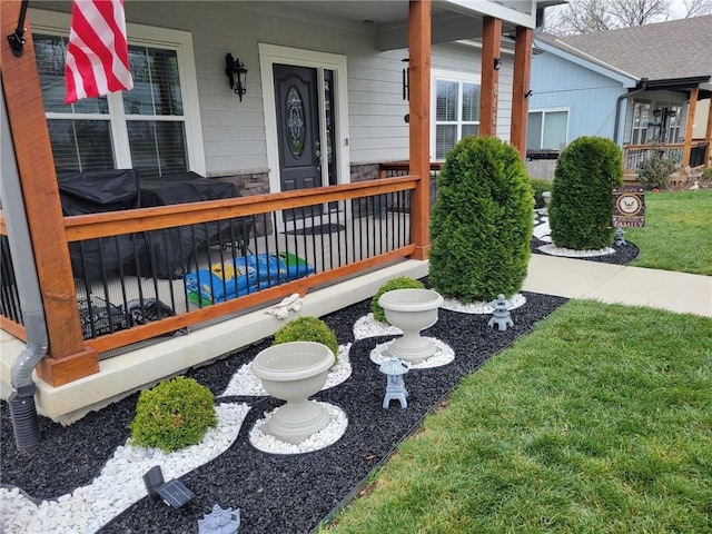 entrance to property featuring a porch