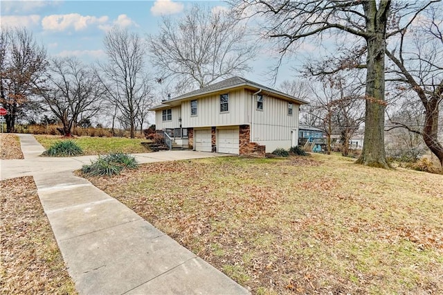 view of home's exterior with a yard and a garage