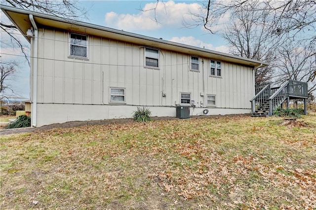 view of home's exterior with a yard and cooling unit