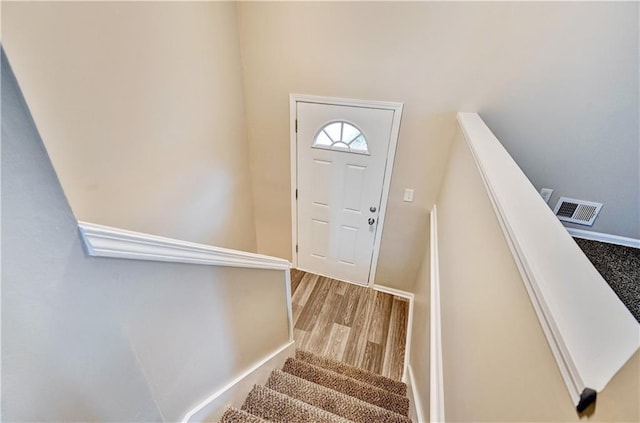 foyer with light hardwood / wood-style floors