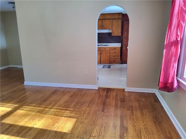 empty room featuring hardwood / wood-style floors