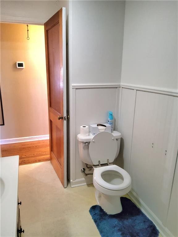 bathroom featuring toilet and vanity