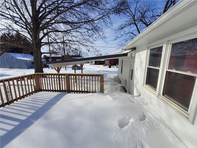 view of snow covered deck