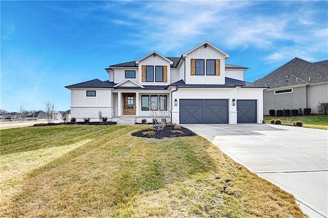 modern inspired farmhouse featuring a garage and a front lawn