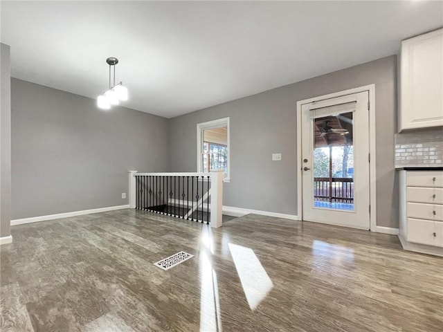 interior space with hardwood / wood-style floors and a chandelier