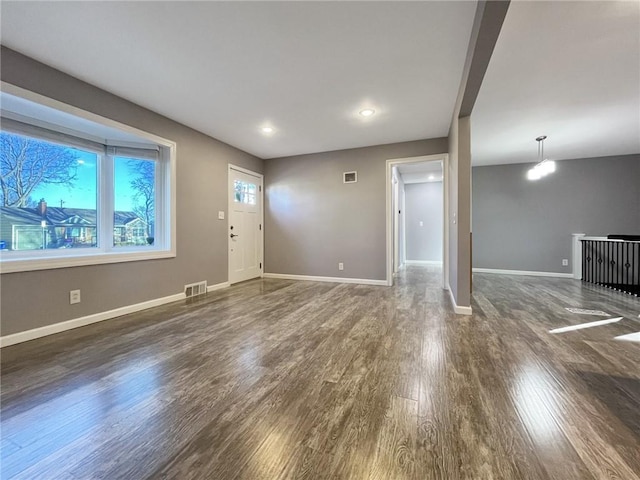 entrance foyer featuring dark hardwood / wood-style flooring