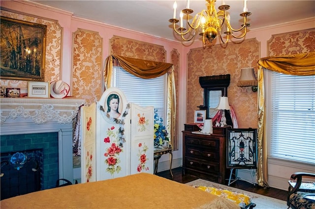 bedroom with dark wood-type flooring, crown molding, and a chandelier