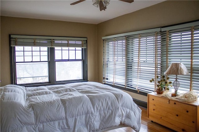 bedroom featuring ceiling fan and hardwood / wood-style flooring