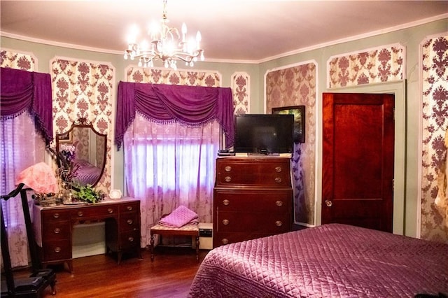 bedroom featuring hardwood / wood-style floors, crown molding, and a notable chandelier