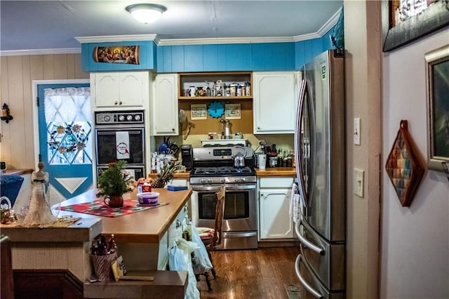 kitchen featuring crown molding, white cabinets, dark hardwood / wood-style floors, and stainless steel appliances