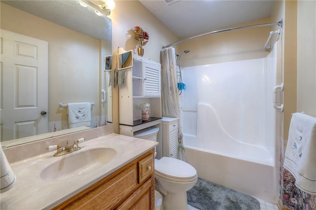 full bathroom with vanity, shower / tub combo, and toilet