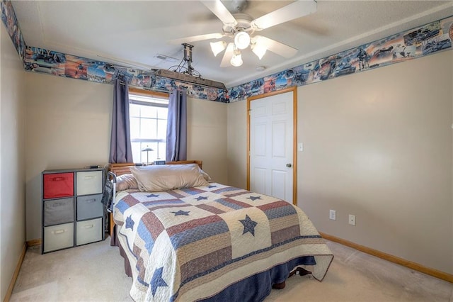 carpeted bedroom with ceiling fan