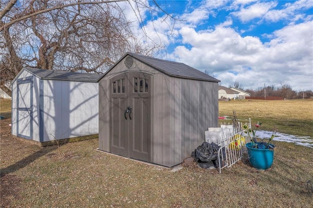 view of outdoor structure featuring a lawn