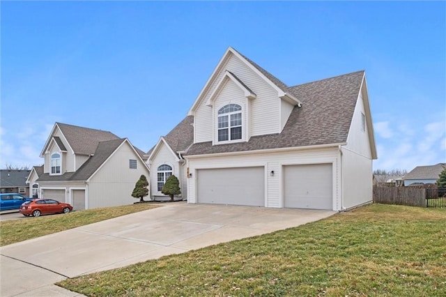 view of front of home featuring concrete driveway, a front lawn, a shingled roof, and fence