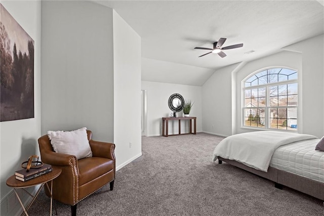 carpeted bedroom featuring a ceiling fan, vaulted ceiling, and baseboards