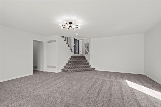 interior space with carpet, visible vents, stairway, and a chandelier