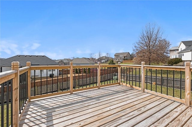 wooden terrace featuring a residential view