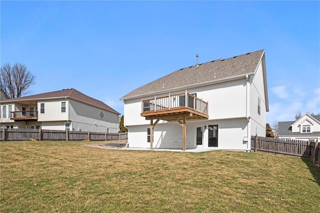 back of property featuring a fenced backyard, a lawn, and french doors