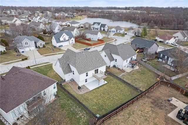 bird's eye view featuring a water view and a residential view