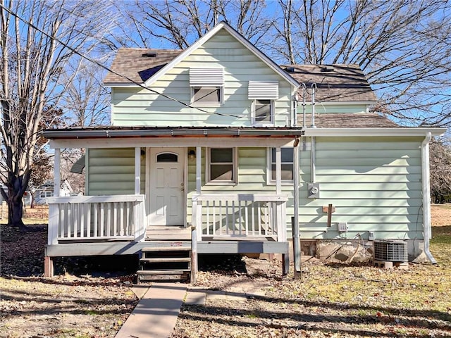 view of front facade with covered porch and central air condition unit