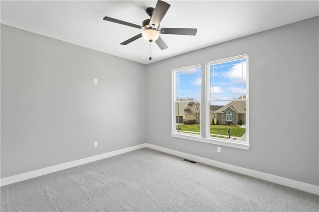 carpeted empty room with ceiling fan