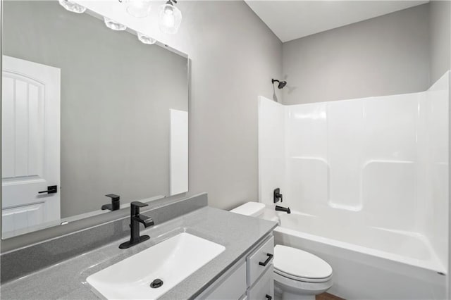 full bathroom with toilet, vanity, and shower / bathtub combination