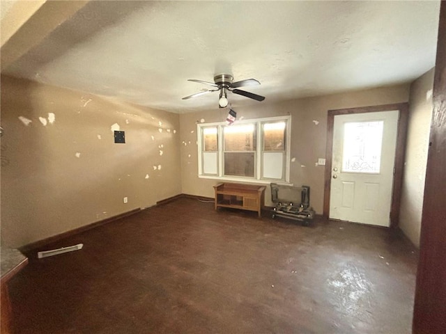 unfurnished living room featuring ceiling fan