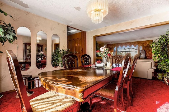 dining area featuring a textured ceiling, a notable chandelier, and carpet flooring