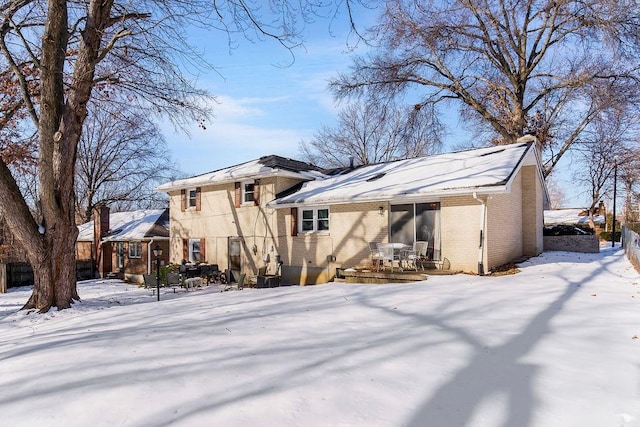 view of snow covered house